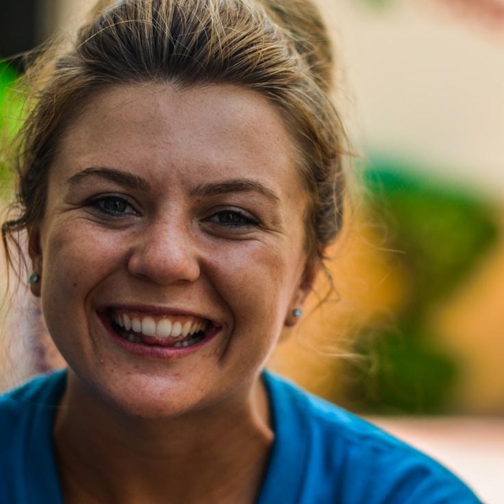 Alex Rivera, Lead Design Curator at MossLoomPrism, reviewing corporate floral arrangements